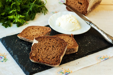 Rye bread and cream cheese with herbs