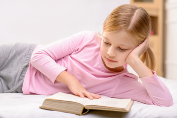 Pretty little girl reading 