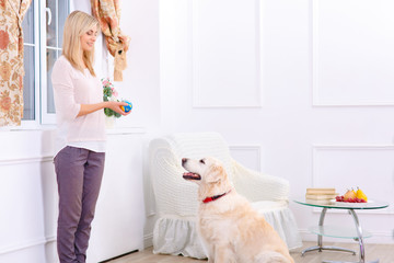 Pleasant woman having fun with a dog 