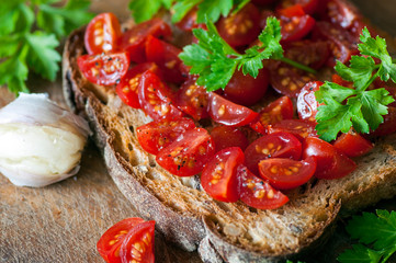 Italian bruschetta with cherry tomatoes on whole grain bread