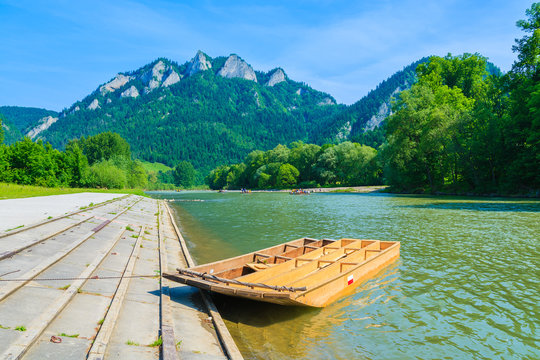 Wooden rafting boat on shore of Dunajec river, Trzy Korony, Pieniny Mountains, Poland