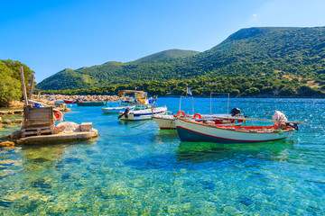 Greek fishing boats on turquoise sea water, Kefalonia island, Greece - obrazy, fototapety, plakaty