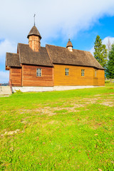 Old wooden orthodox catholic church in Oderne village on sunny autumn day, Beskid Niski Mountains, Poland