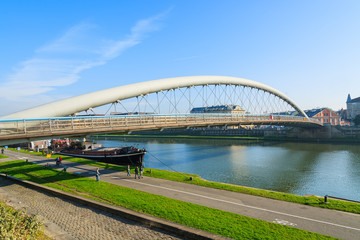 Bernatka bridge over Vistula river on sunny autumn day in city of Krakow, Poland
