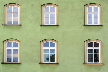 Fototapeta na wymiar Windows of an old house in Krakow city, Poland