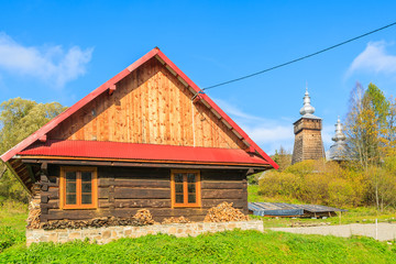 Typical wooden house in Beskid Niski Mountains in autumn season, Poland - obrazy, fototapety, plakaty