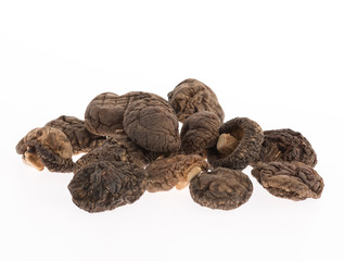 dried shiitake mushrooms on white background