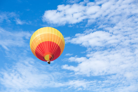 Colorful hot air balloon with blue sky background