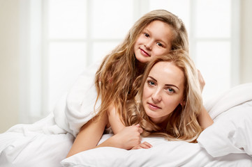 Happy family. Mother and little daughter portrait