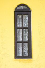 Rustic Brazilian window with drapes