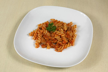 pasta with meat and herbs in sauce