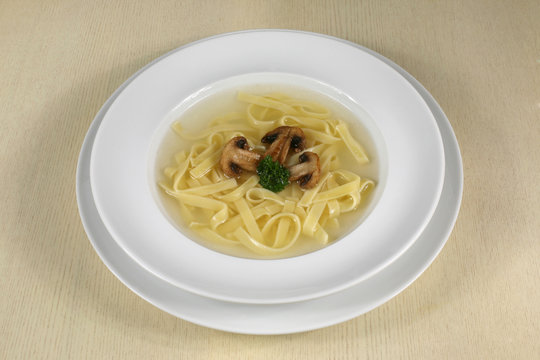 portion of mushroom soup with noodles