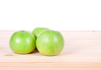 Apples on the wooden background