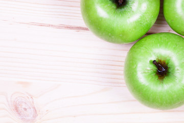 Apples on the wooden background