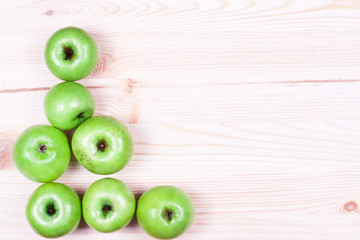 Apples on the wooden background