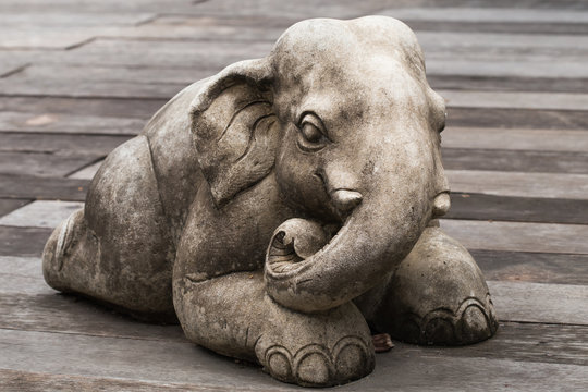 Elephant statue on the wooden floor