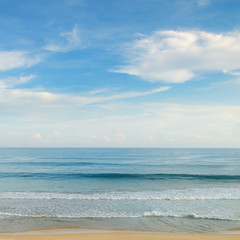 Fototapeta na wymiar ocean, sandy beach and blue sky
