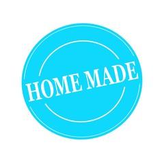 HOME MADE white stamp text on circle on blue background
