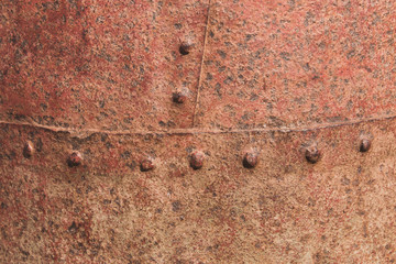 Background of rusted riveted metal surface