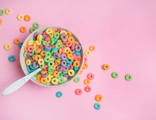 Tuinposter Colorful cereal  on a pink  background © pauchi
