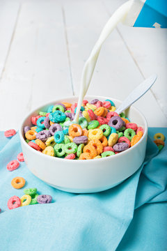 Milk pouring into plate with Colorful cereal