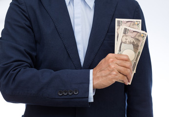 Businessman hand holding Japanese banknote