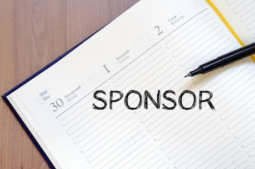 Sponsor write on notebook