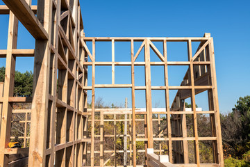 Fototapeta na wymiar Wooden frame of a new house under construction