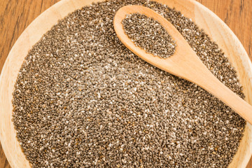 Nutritious chia seeds on a wooden plate