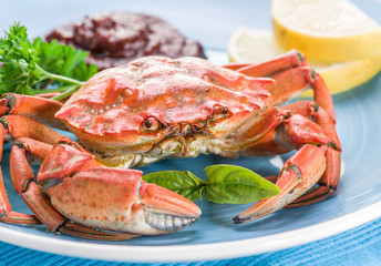 Cooked crab with lemon and herbs.