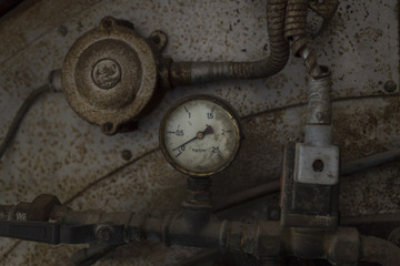An old gauge and some electricity wires 