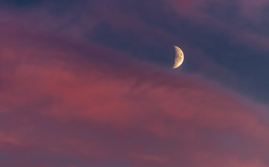 crescent in the red sky