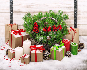 Christmas decoration with burning candles and gift box