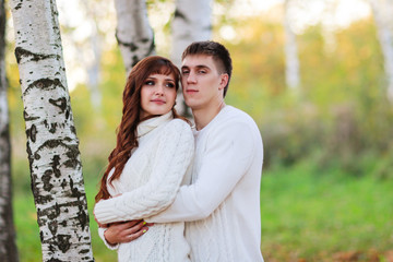love, happy couple in park with birch trees, summer, autumn suns