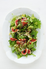 salad with slice of figs and grapes