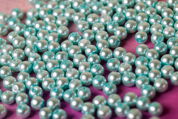 string of pearls delicate pink color, in soft focus, with highlights