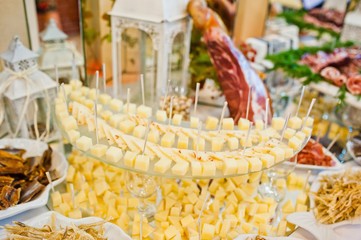 Wedding reception. Table of cheese, meat and peanuts