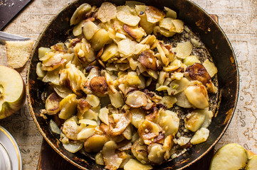 Fried potato on pan in real kitchen