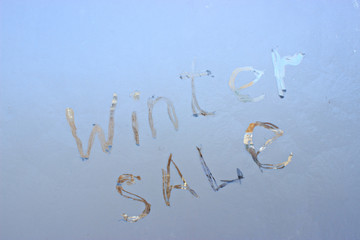  written on frosty winter window background
