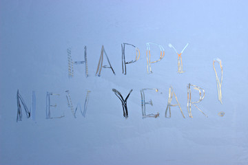  written on frosty winter window background