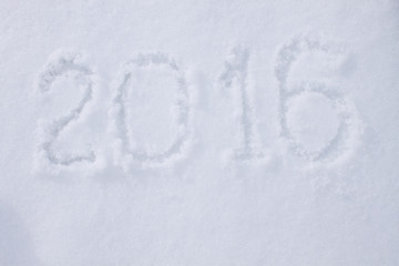 "2016" written on snow surface.