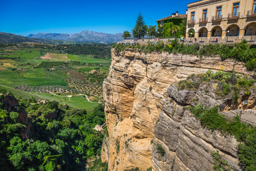 view of buildings over cliff in ronda, spain