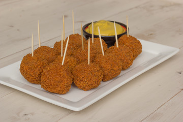 Dutch snack bitterballen with mustard and cocktail picks