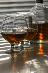 Brandy pour into glasses.
