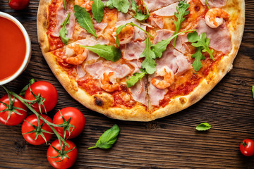 Delicious italian pizza served on wooden table