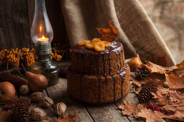 Traditional homemade carrot cake delicious dessert. Dark food photo autumn composition on vintage wooden table background