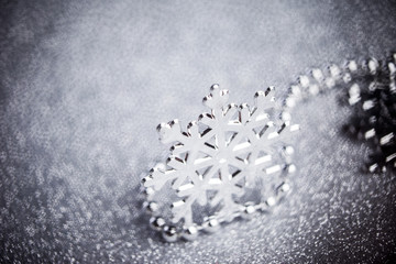 silver snowflake on shiny background