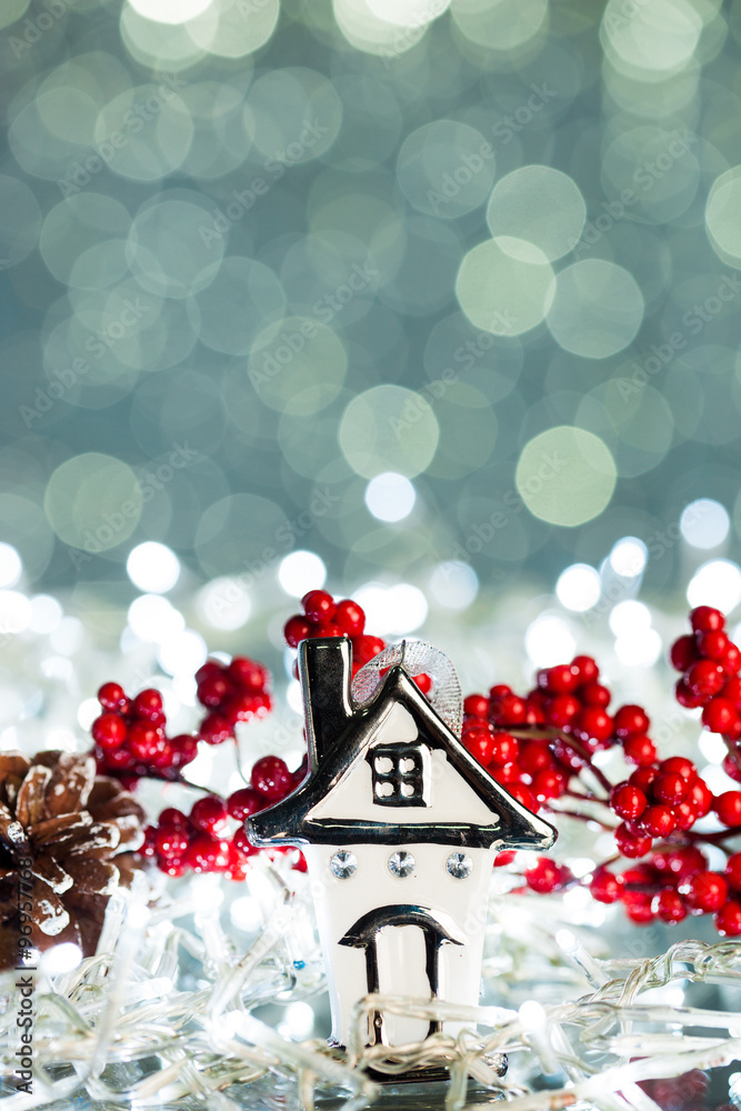 Poster house with european holly on sparkles background