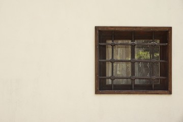Obraz na płótnie Canvas Old Window With Rusty Forged Bars