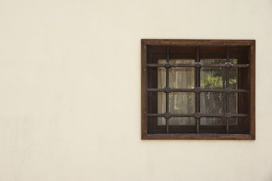 Old Window With Rusty Forged Bars